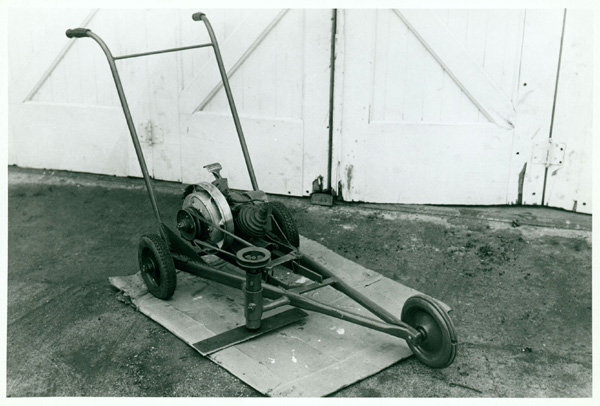 A photograph of a homemade lawn mower.